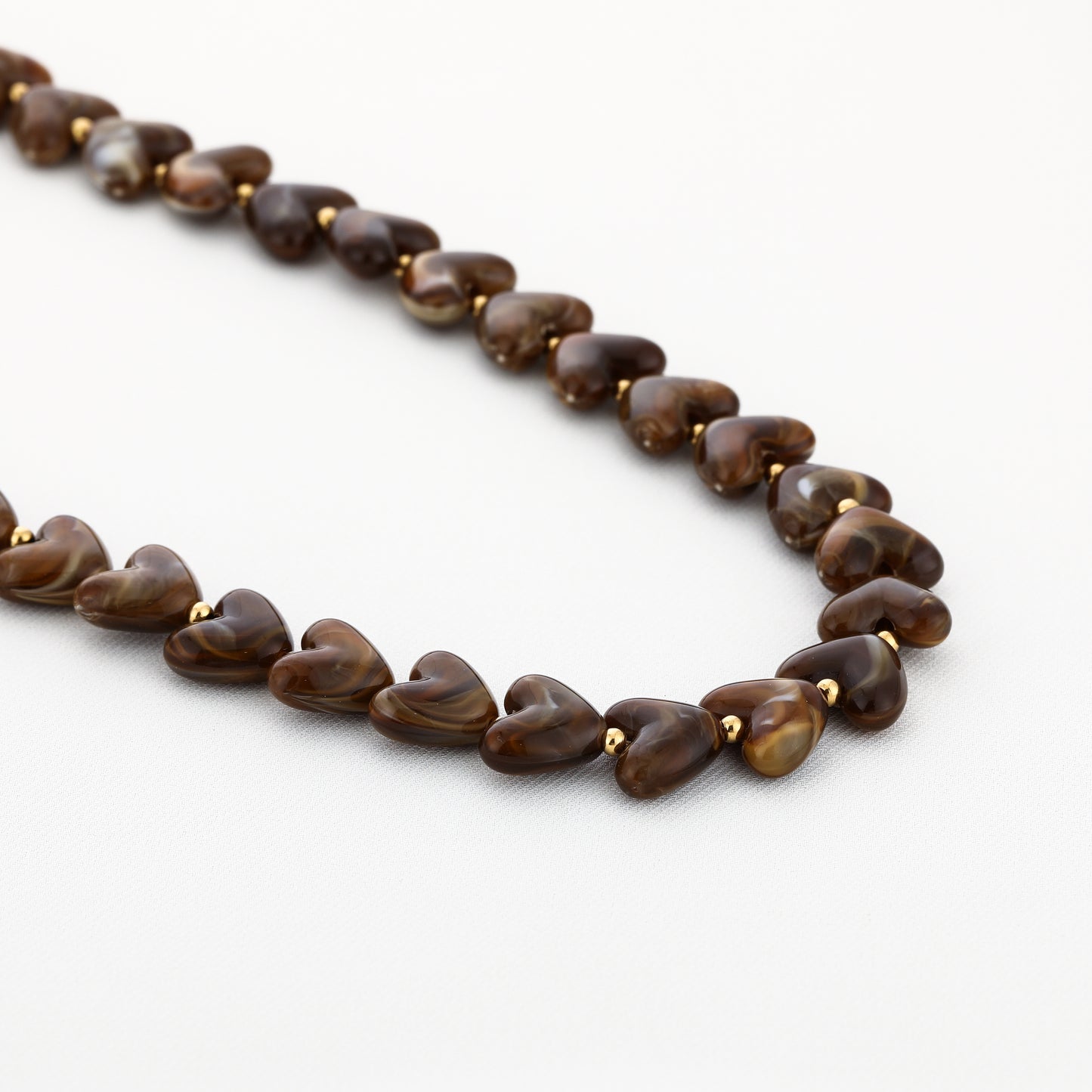 Kralenketting in hartjesvorm | Goud & Bruin