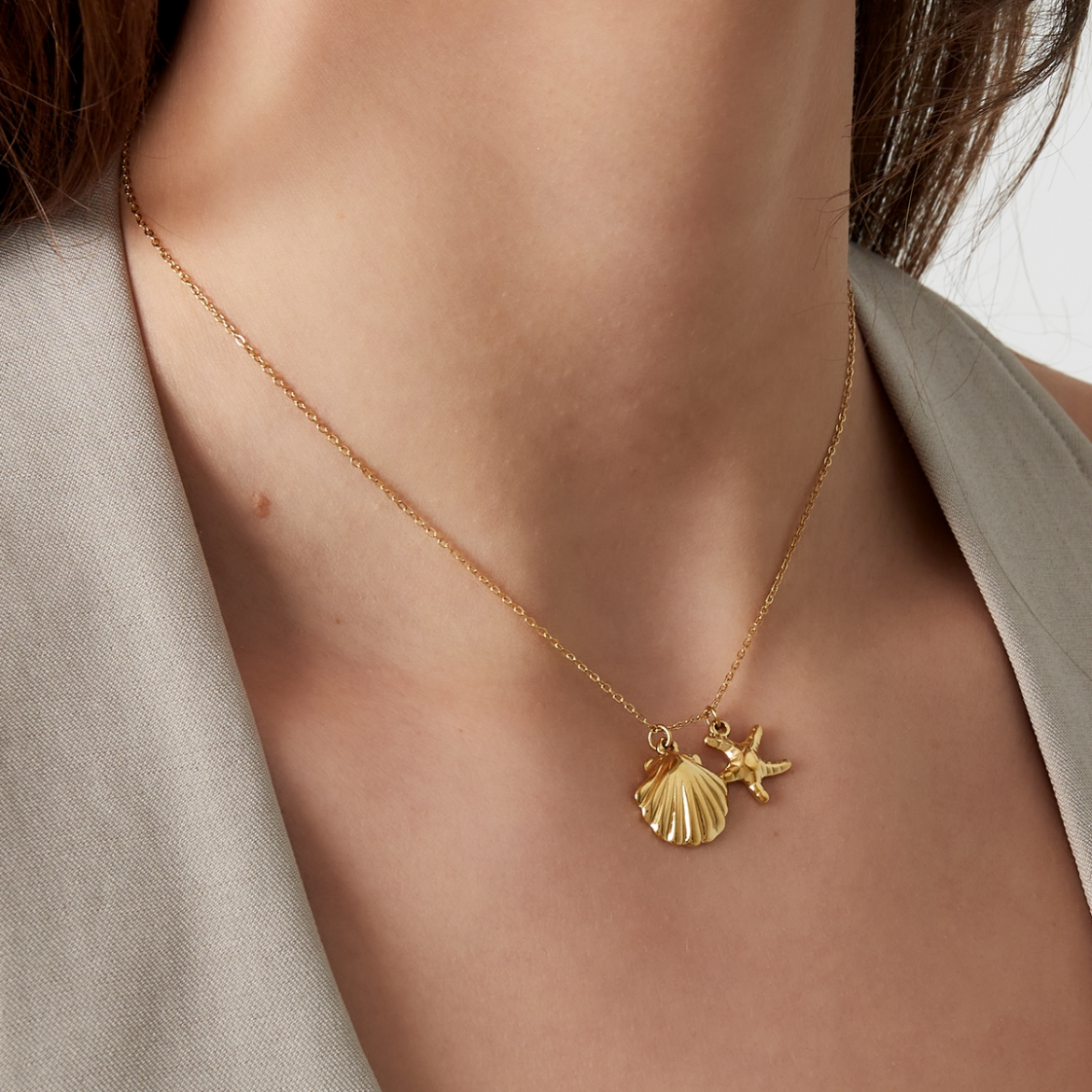 Ketting met schelp en zeester | Goudkleurig