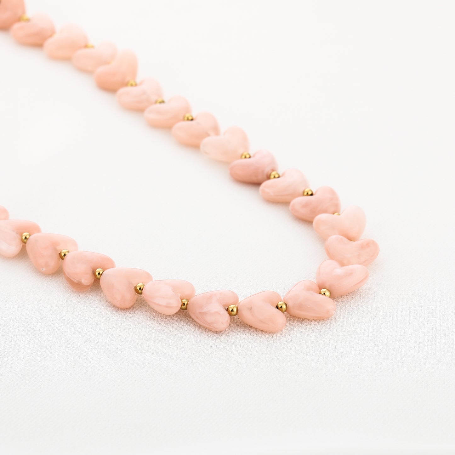 Kralenketting in hartjesvorm | Goud & Roze
