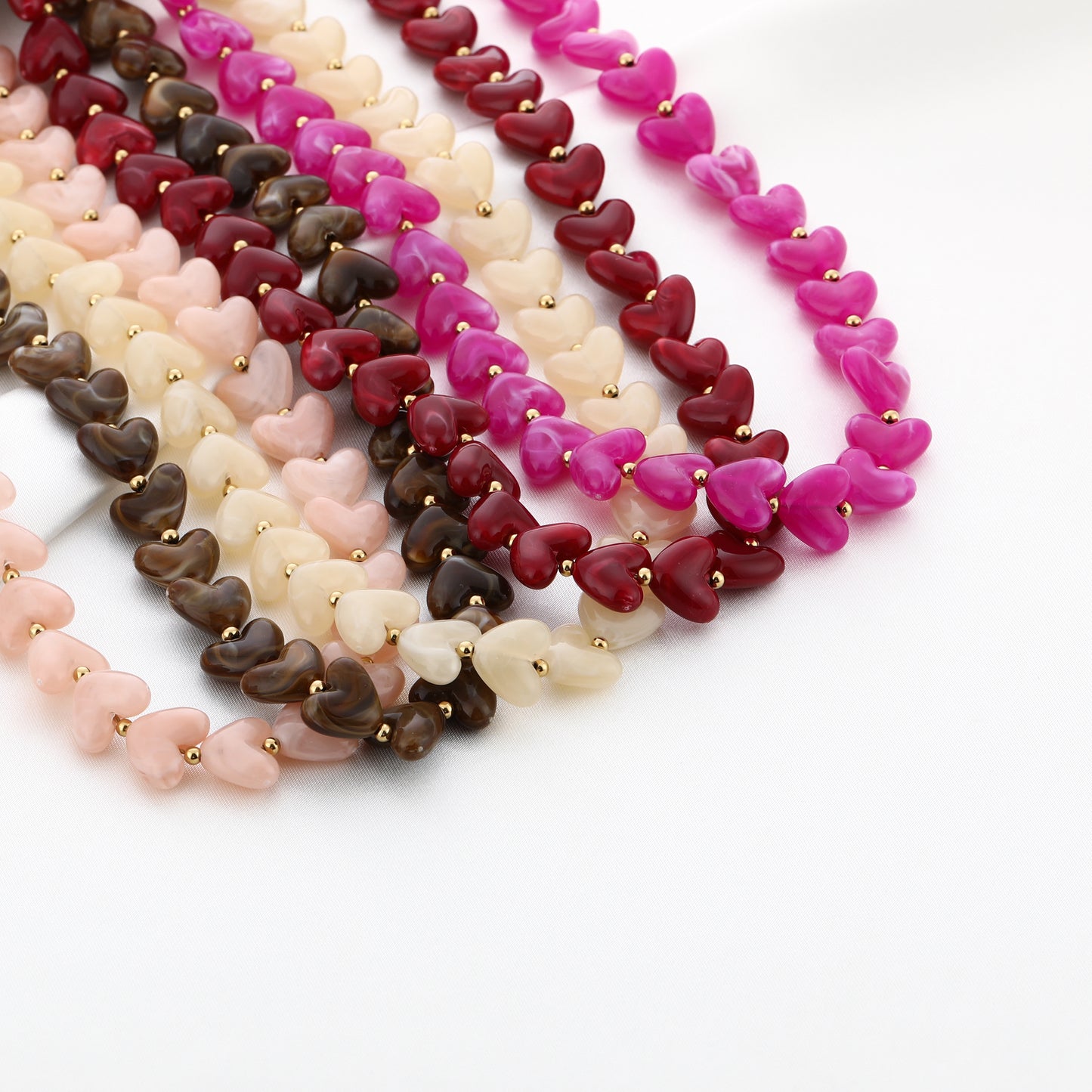 Kralenketting in hartjesvorm | Goud & Fuchsia