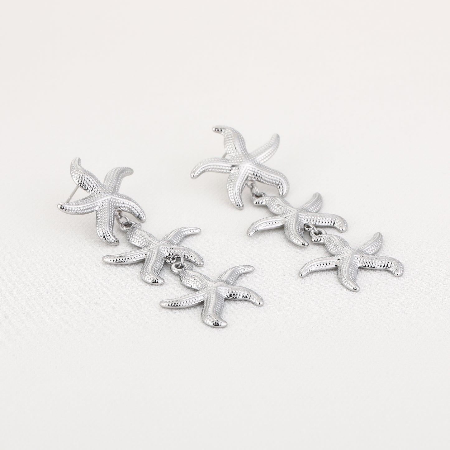 Oorbellen met 3 zeesterren op rij | Zilverkleurig