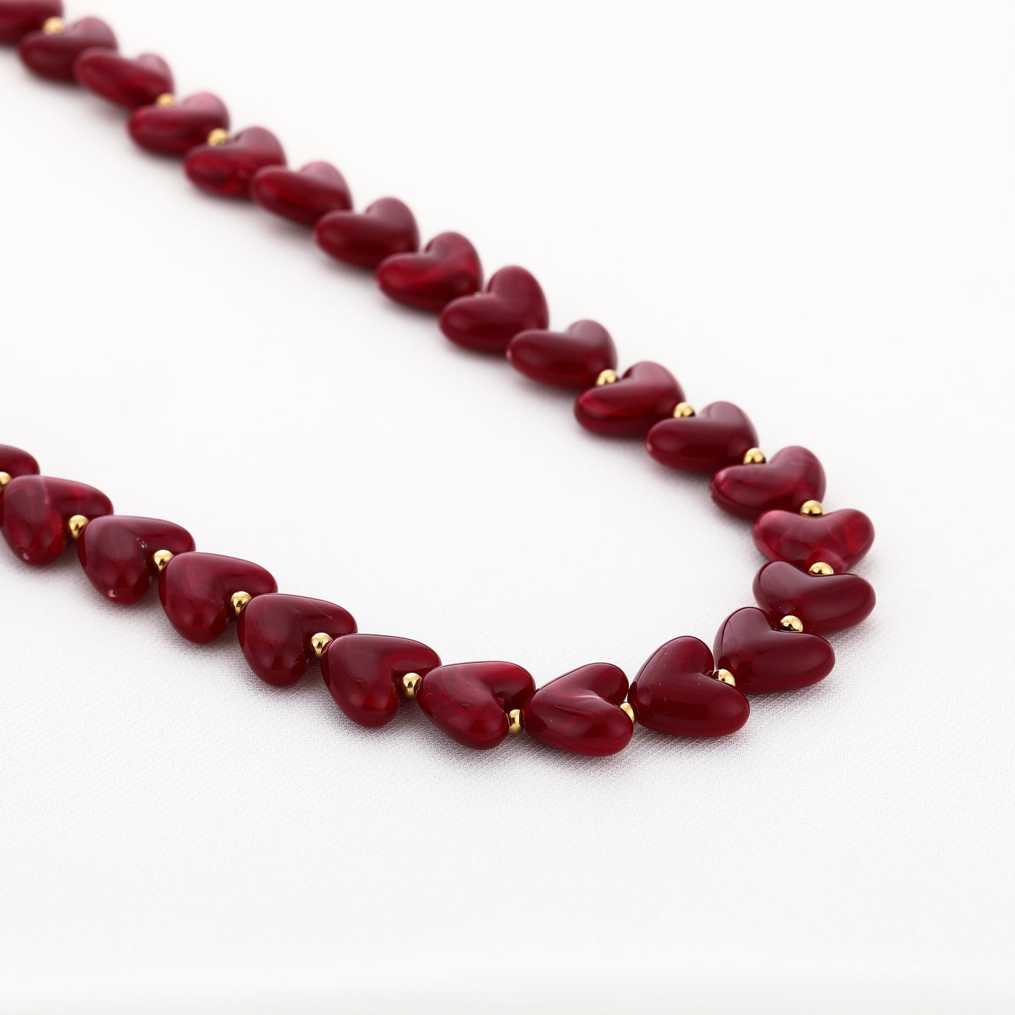 Kralenketting in hartjesvorm | Goud & Paars