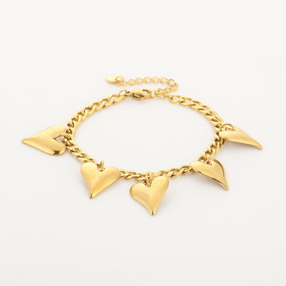 Bedelarmband met dunne hartjes | Goudkleurig