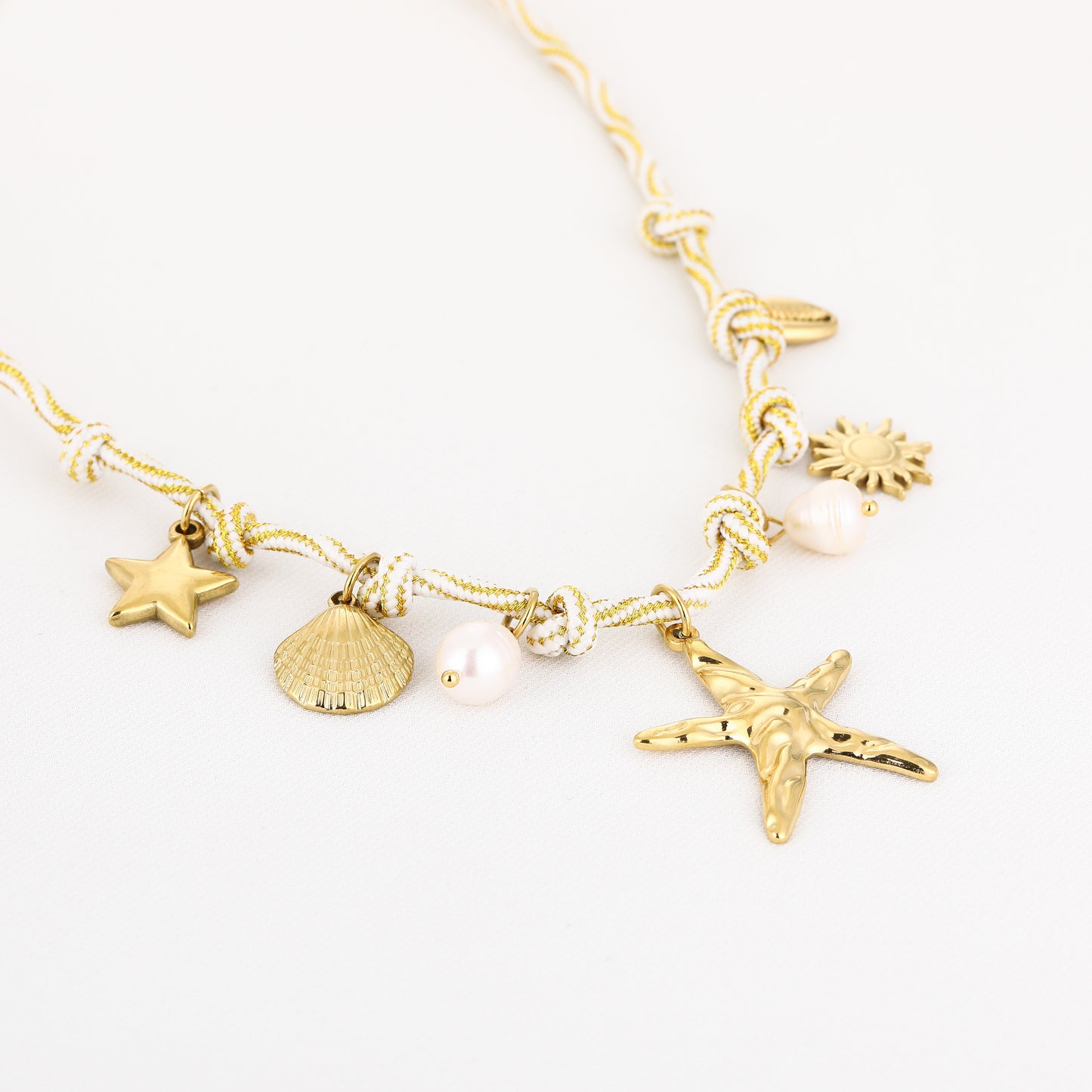 Bedelketting met leuke zee bedels | Goudkleurig